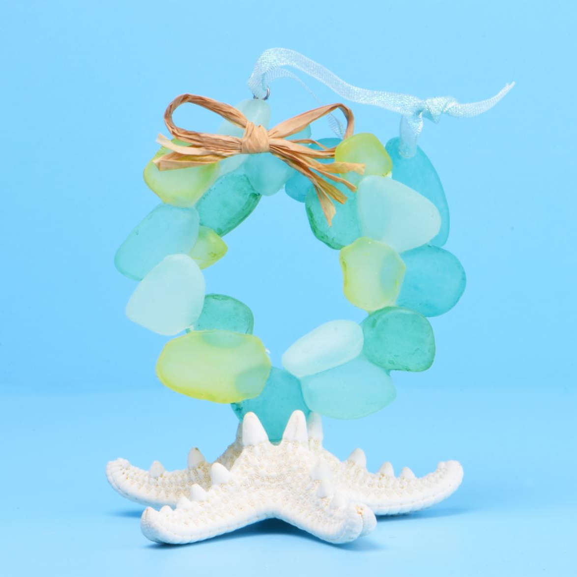 Sea Glass Wreath Ornament sitting on a starfish