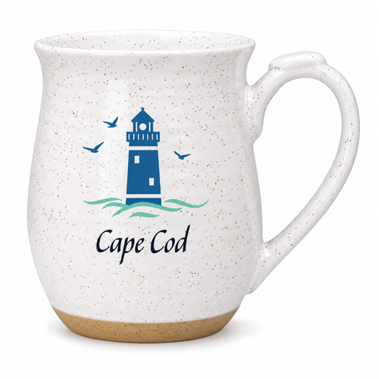 A speckled white ceramic mug with a blue lighthouse and waves graphic on the front, featuring the text 'Cape Cod' and four blue birds, set against a plain white background.