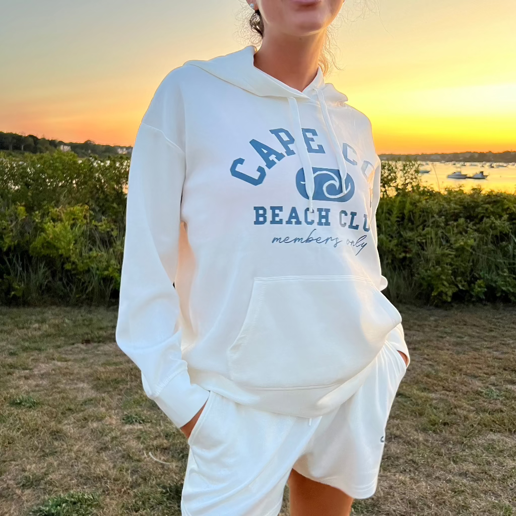 Cape Cod Wave Hooded Sweatshirt worn by model at Oyster Pond in Chatham.